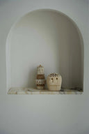 Handmade cultural tribal statue, crafted from durable sandstone with subtle variations in color and texture.