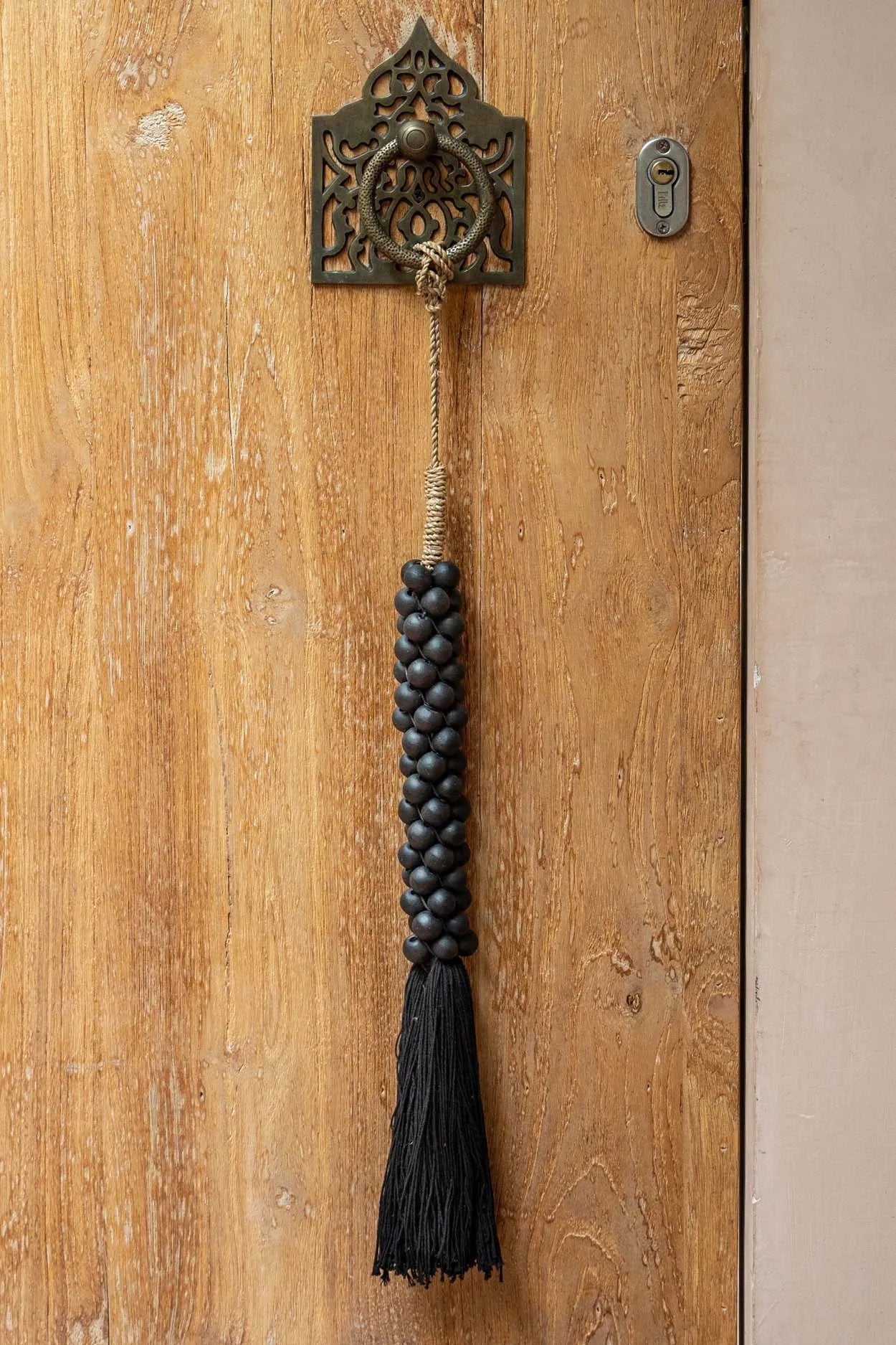 the-wooden-beads-with-cotton-tassel-black