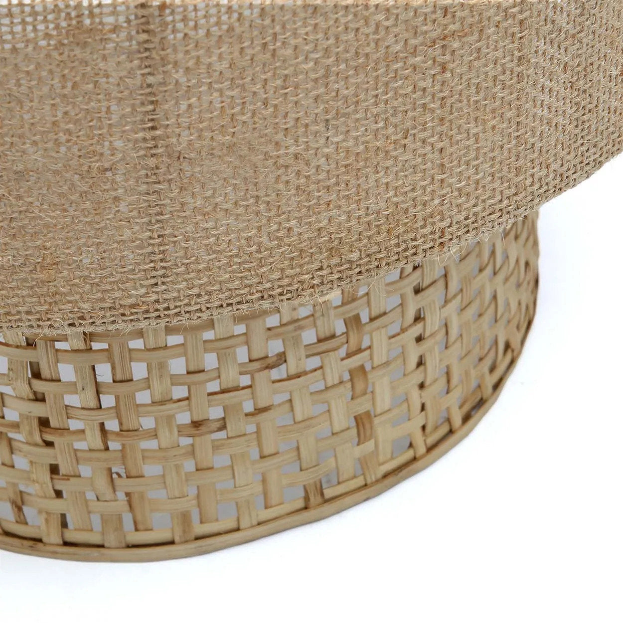  The Bolly Jute Wall Lamp in natural tones, showcasing its woven texture and soft ambient light ideal for cozy interiors