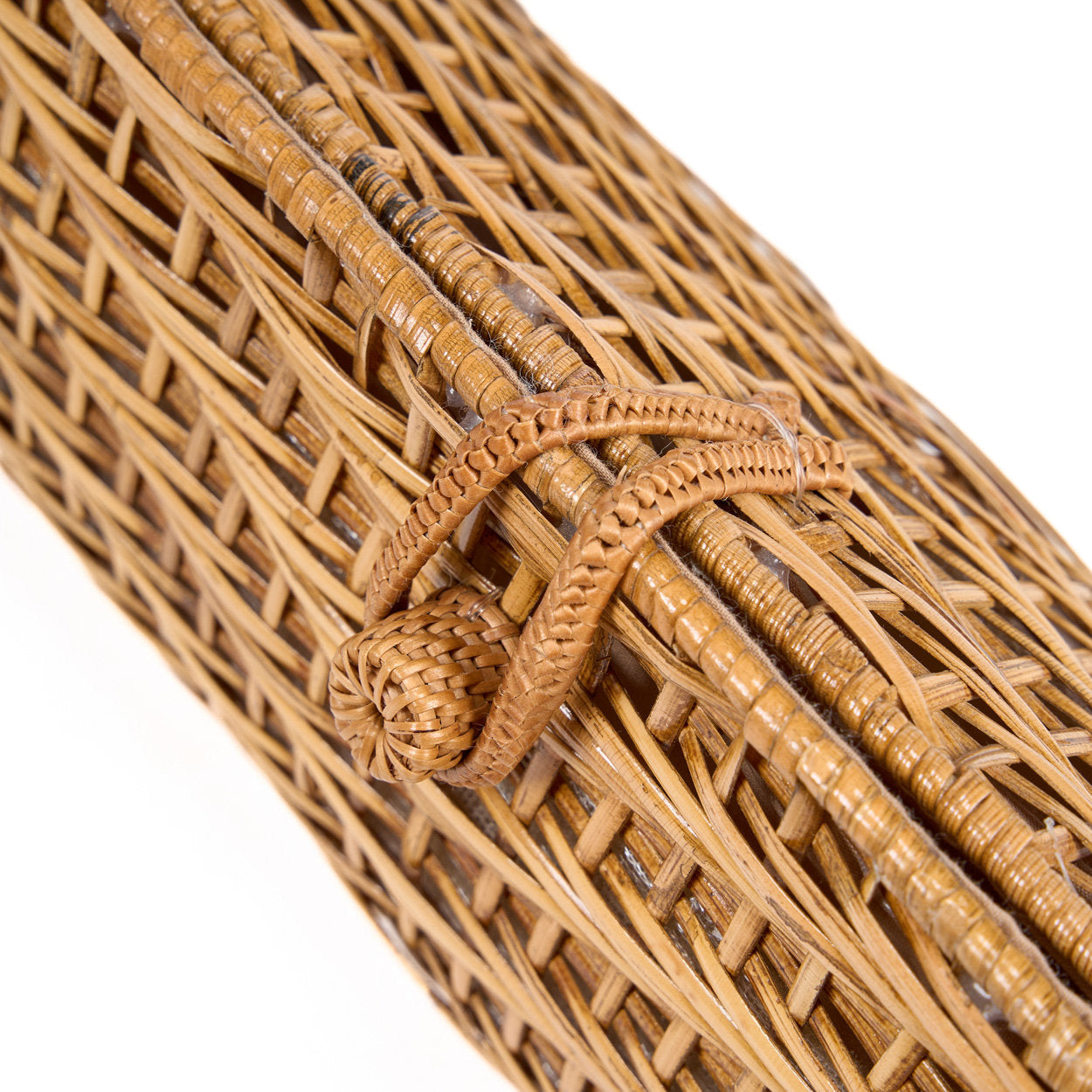 Artisan-crafted natural fiber clutch, each piece unique with subtle variations in weave and texture.