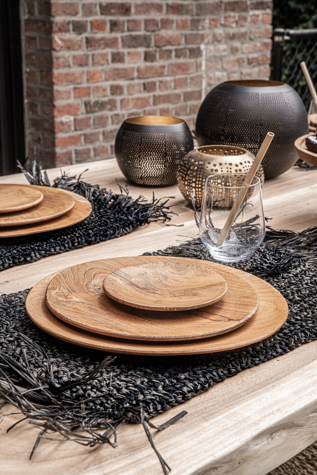 Medium brass candle holder in black gold finish, handmade with pierced surface details.
