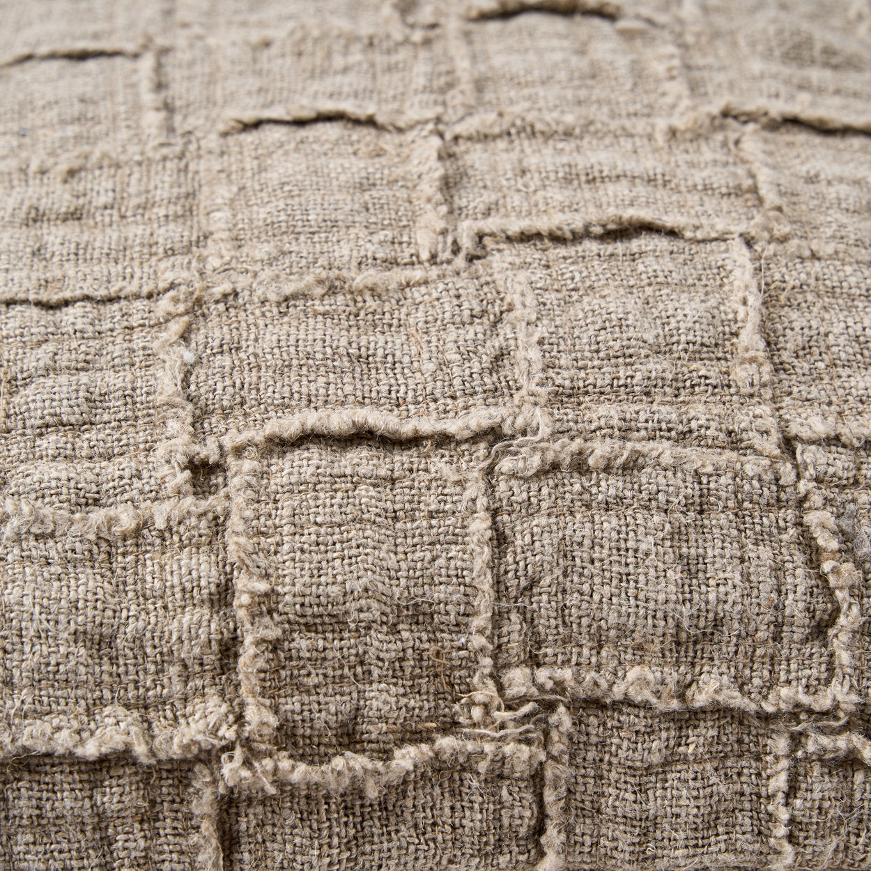 Artisan-crafted natural linen cushion cover with subtle cross-weave texture for a cozy home look