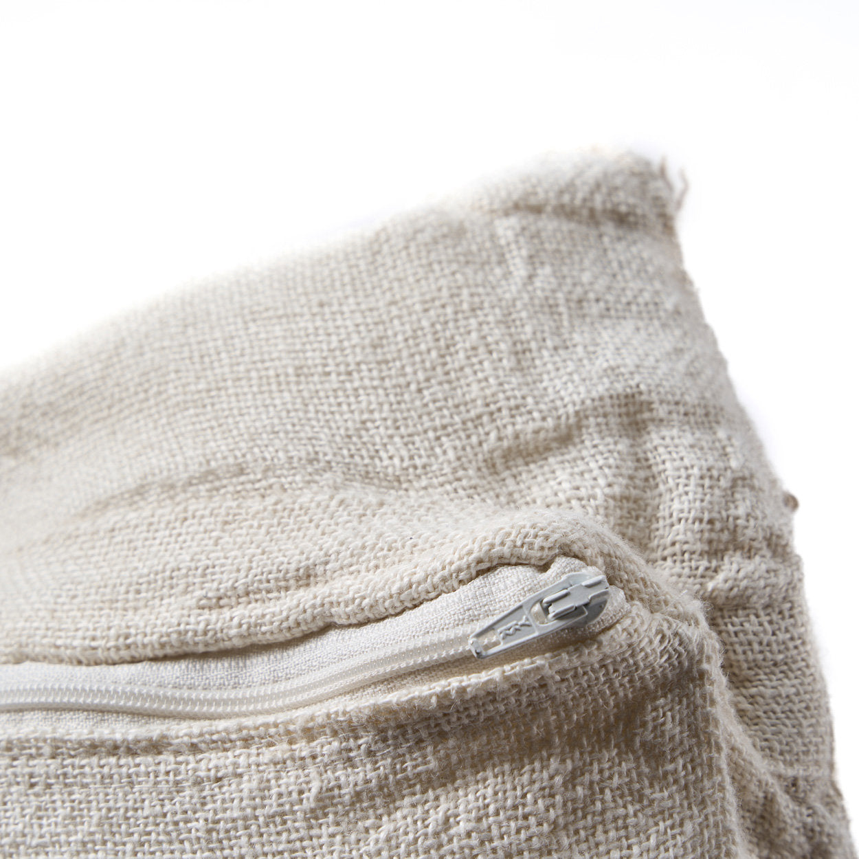 Soft square linen pillow cover in natural white, perfect for layering on sofas or beds