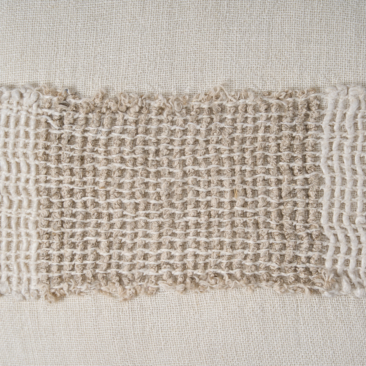 Handcrafted linen cushion cover in white natural tone, perfect for sofas, beds, or lounge chairs.