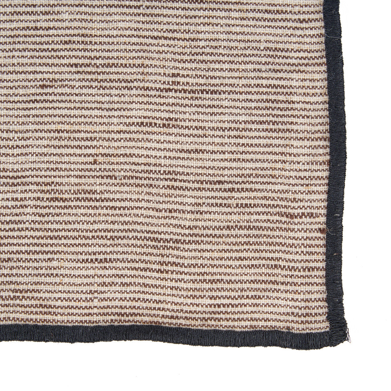 Folded black and natural striped linen napkin, soft and breathable fabric for everyday dining