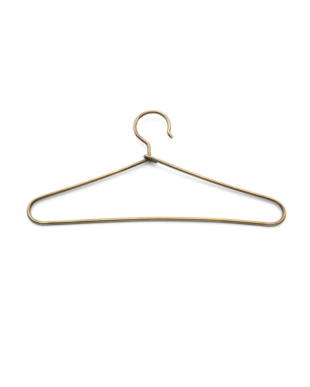 The Cintre d’Or Gold Medium, brass clothes hanger for elegant wardrobe organization.