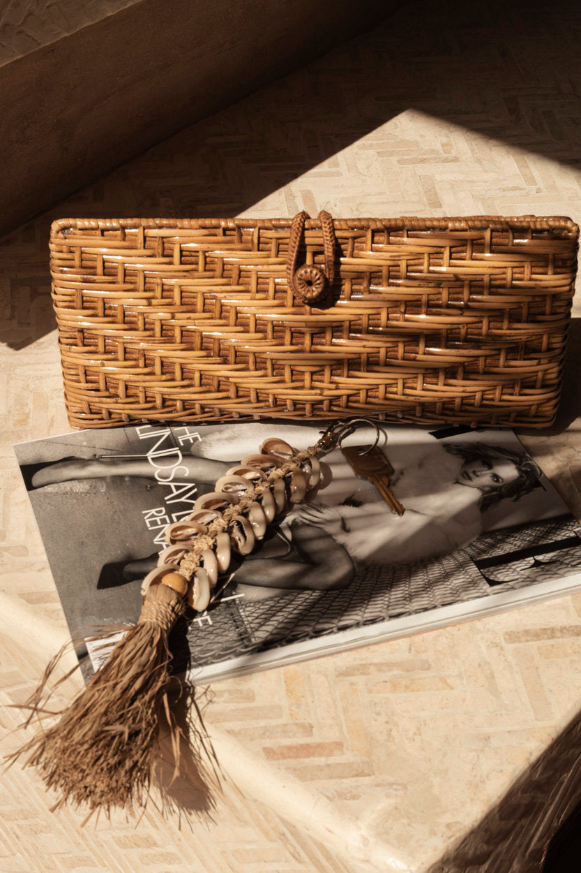 Bohemian-style woven clutch, perfect for garden parties, festivals, or relaxed city strolls.