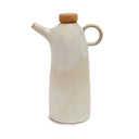 White ceramic olive oil bottle with natural cork and elegant form.