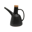 A black olive oil dispenser for everyday use with handle and natural cork.