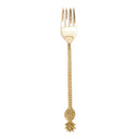 A brass pineapple fork in golden touch,  decorative cutlery to serving fruits or salads.