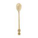 A brass spoon for dining with a twisted handle and pineapple accent in golden tone.