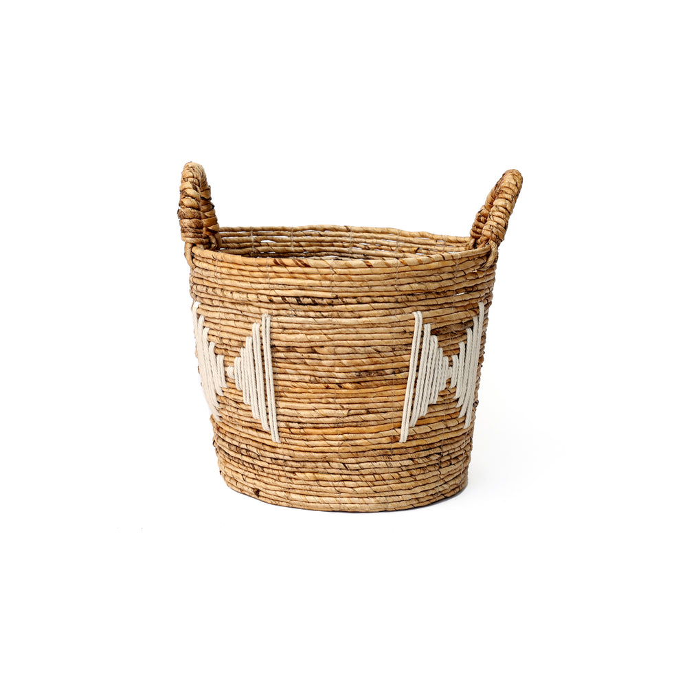 Small woven storage basket in round form with intricate stitches.
