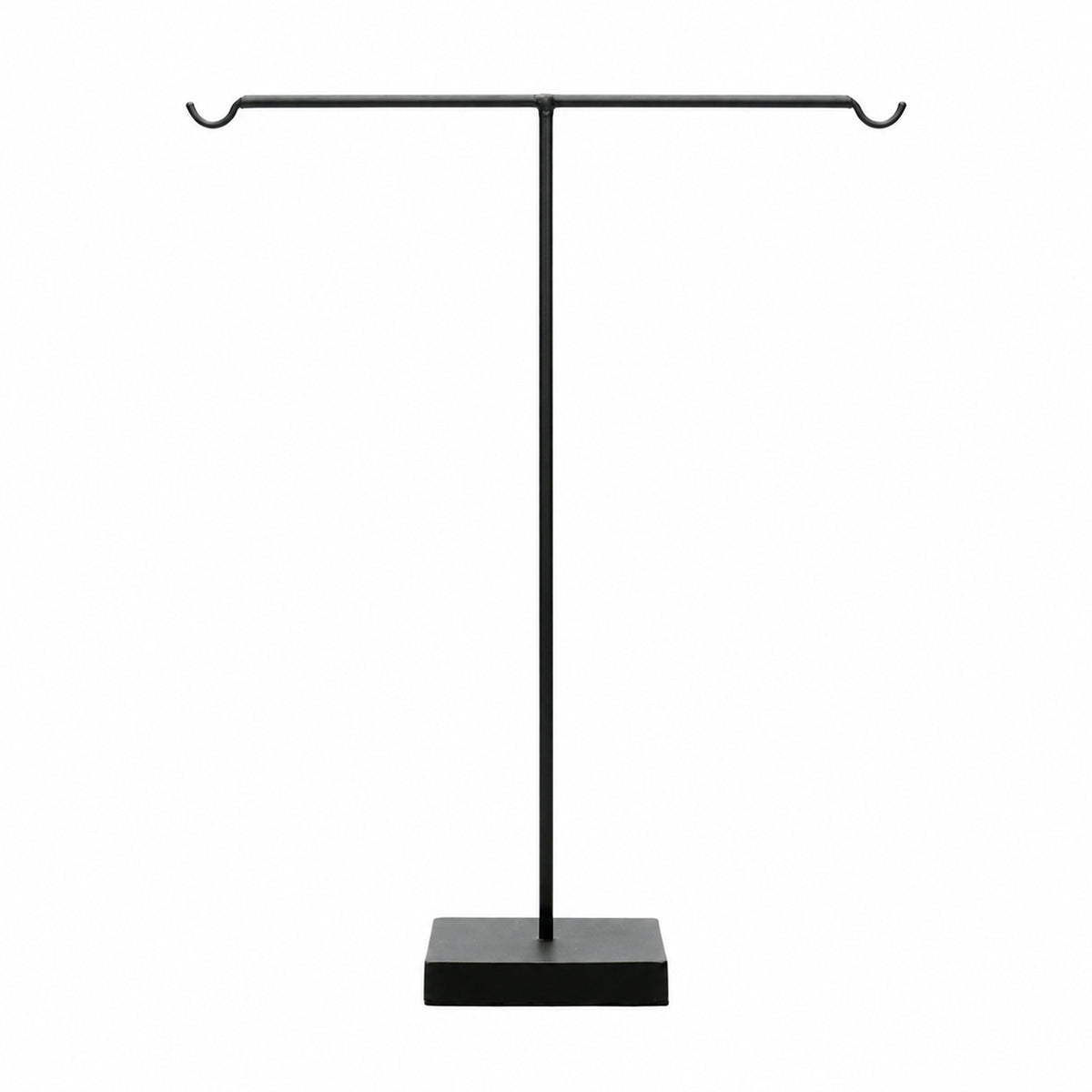 A tall tabletop display stands in a t-bar silhouette with a solid, weighted square base.