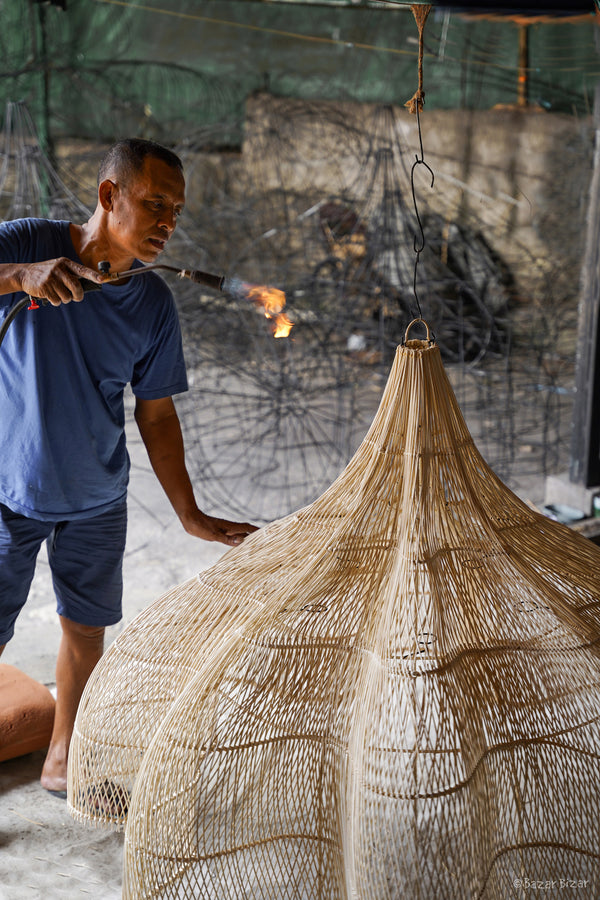 Rattan is flame-finished for a smooth, refined shape.